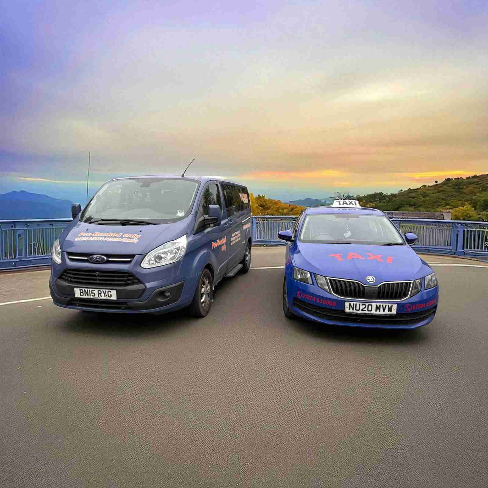 Talgarth-Taxi-Cars1 Two Talgarth Taxis vehicles, including a blue taxi with a roof sign, parked side by side with mountains behind
